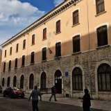Il pi� antico istituto della citt�: la scuola media  San Nicola, nata nel 1896 come �Regia Scuola d�Arti e Mestieri Umberto I�. Costruita al posto dello scomparso Ospizio dei Pellegrini, si trova in largo Urbano II, lo stradone che affianca la Basilica. Si presenta austero, privo di elementi classicheggianti e si sviluppa su tre livelli, con una fascia inferiore in bugnato rustico e la parte superiore intonacata in giallo pallido